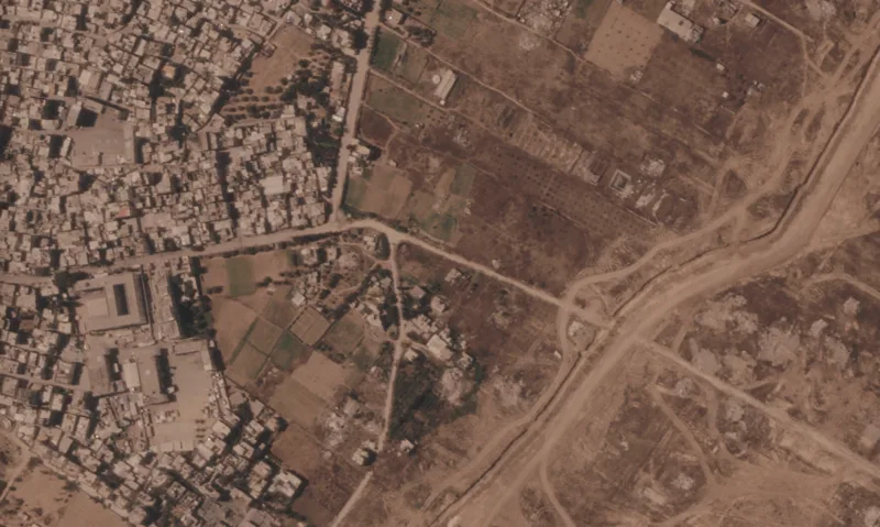 Israel is building a miles-long earthen barrier  inside Gaza, entrenching its division